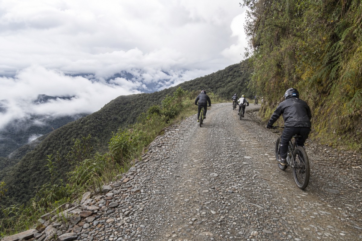 Cyclists descending the gravel Death Road
