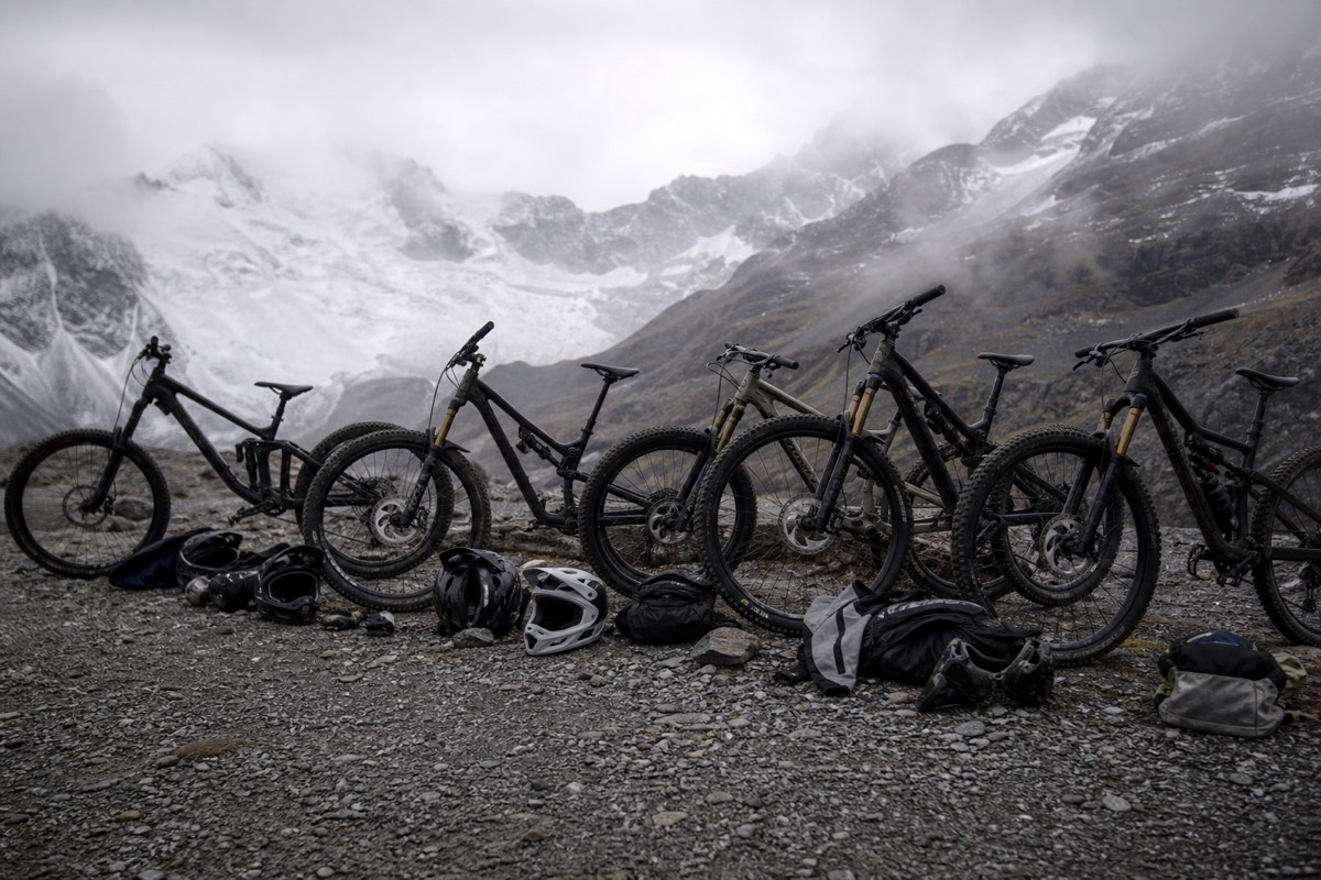 Guides checking mountain bikes and helmets during a Death Road safety briefing near La Paz